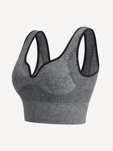 Detail of dark grey seamless sports bra featuring ribbed texture and V-neckline design