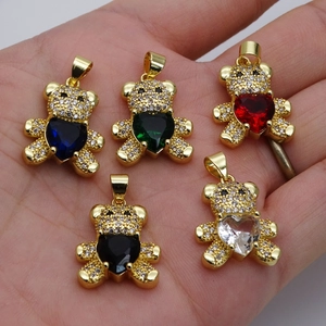 Gold teddy bear pendant with micro-pave cubic zirconia and heart-shaped colorful stones
