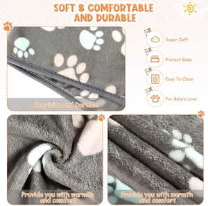 Macro shot of fluffy grey pet blanket with white paw prints showing plush texture