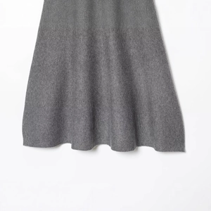 Elegant grey knit dress featuring high-quality fabric texture and smooth draped silhouette