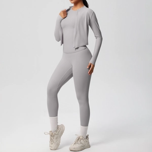 Three-piece yoga set including zip jacket and high-waist leggings in light grey fabric