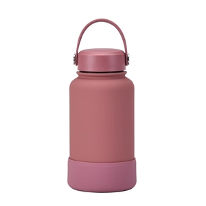 Detail of 650ml pink stainless steel bottle with silicone base and carry handle