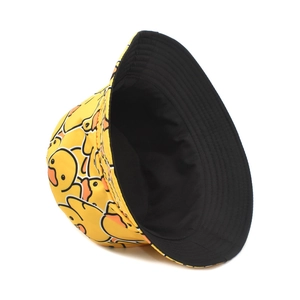 Double-sided reversible yellow bucket hat with cartoon duck print and black interior lining