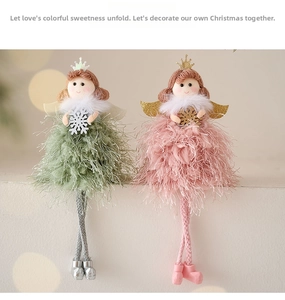 Close-up of pink and green plush Christmas angel dolls with snowflakes and crowns