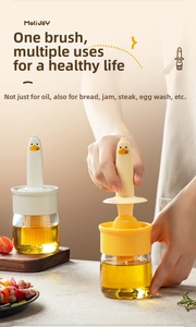 Detail of cute duck-shaped silicone oil brush and glass bottle for kitchen use