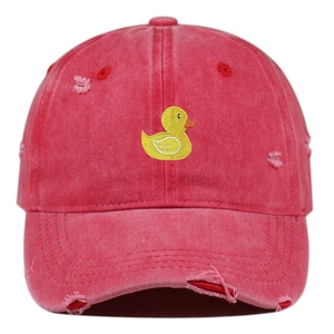 Detailed view of red washed cotton baseball cap featuring duck embroidery and distressed holes