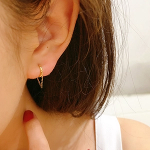 Detail view of S925 sterling silver gold drop earrings with delicate chain tassels