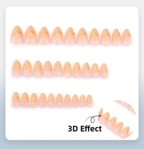 Detail von 3D-Perlenverzierung und orangefarbenem Farbverlauf auf Almond-Klebe-Nägeln