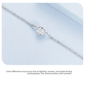 Macro shot of S925 sterling silver bracelet featuring a hollow rose pendant and rope chain