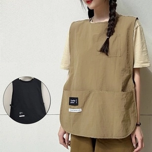 Detailed view of durable waterproof work apron with functional pockets for staff