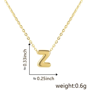 Detail view of gold letter Z pendant necklace showing dimensions 0.33 by 0.25 inches
