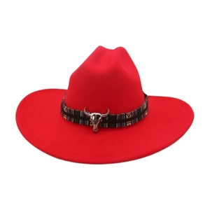Detailed view of a red cowboy hat with an ethnic band and silver bull skull accent.