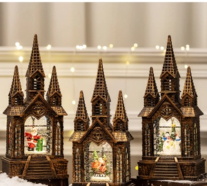 Detailed trio of vintage bronze church snow globes with Santa and snowman scenes