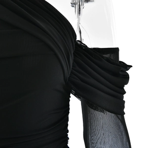 Detail of black mesh dress featuring elegant ruching and one-shoulder sheer sleeve design