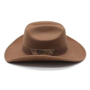 Detail of dark brown felt fedora featuring vintage patterned band and metal buckle