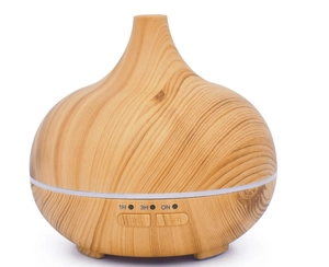 Detailed control panel of wood grain diffuser showing timer settings and mist buttons