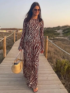 Women's long sleeve zebra print maxi dress in a slim fit style for beach vacations