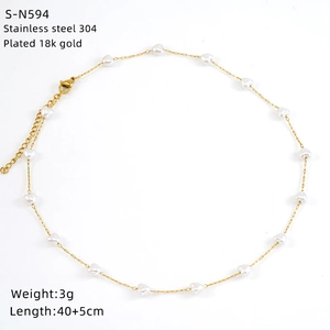 Detail of 18k gold plated stainless steel necklace with small heart bead charm