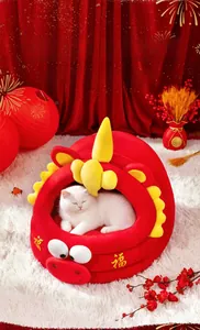 Close-up of red festive cat bed with golden Fu character and soft plush material