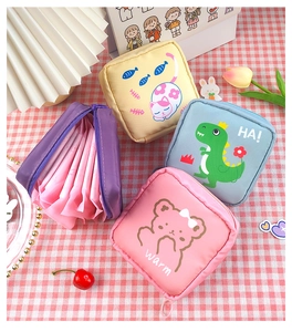 Cute cartoon sanitary napkin storage bags in four colors on a red checkered background