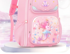 Detail view of pink student backpack featuring a sparkling mermaid princess illustration