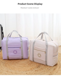 Detail view of large capacity foldable travel bags in purple and beige nylon material