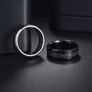 Engraved black titanium steel floral ring with laser-cut cherry blossom patterns