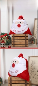 Detail of red velvet Christmas gift bag with embroidered Santa and HO HO HO text
