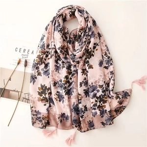 Detail of pink floral scarf with delicate pomegranate prints and tassel pendants