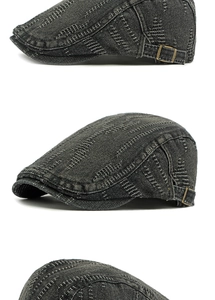 Detail of vintage denim beret with quilted stitching and adjustable bronze metal buckle