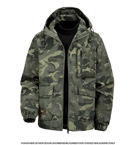 Detail of camouflaged jacket featuring a leather brand tag on a utility cargo pocket