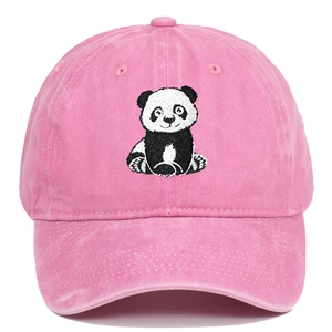 Detailed close-up of panda embroidery on washed pink cotton baseball cap fabric