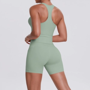 Rear view of sage green racerback sports bra and high-waist yoga shorts set for women
