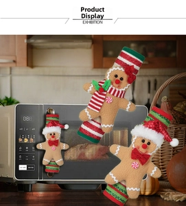 Three gingerbread men doll covers for Christmas kitchen appliance handles and decor