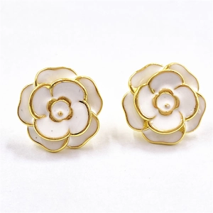 Elegant white camellia flower stud earrings with gold plating and enamel finish
