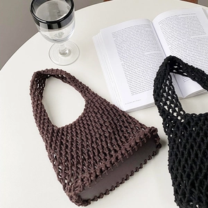 Detailed top view of handmade cotton rope woven tote bags in brown and black colors