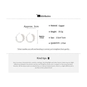 Detailed view of silver mesh hoop earrings with copper base and silver needle specifications
