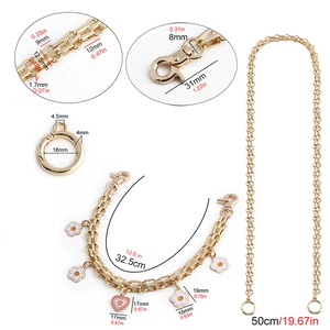 Detail showing dimensions of gold chain straps with heart and flower charms for bags