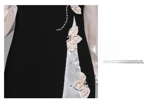 Dettaglio del ricamo floreale a farfalla con paillettes e perle su abito qipao nero