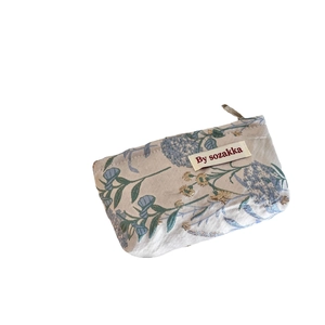 French relief floral cosmetic bag with blue and gold jacquard on a white background
