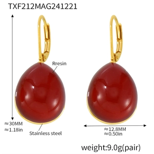 Detail view of red resin teardrop earrings with dimensions 30mm height and 12.8mm width
