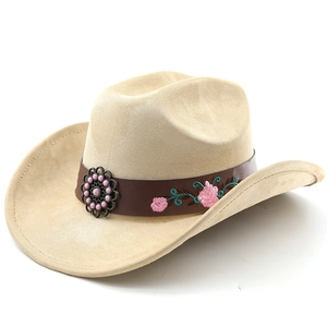 Close-up of brown leather belt with floral rose embroidery on beige suede cowboy hat