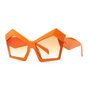 Modern oversized orange geometric sunglasses with vibrant gradient lenses in a stylish frame