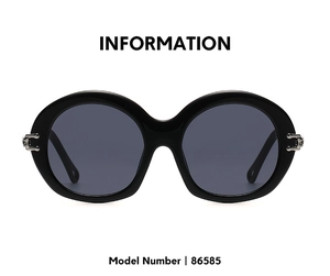 Detail view of round vintage sunglasses with silver metal hollow hinges and gray lenses