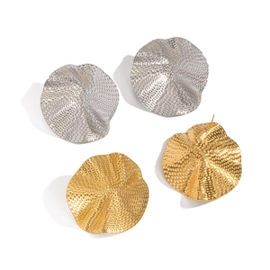 Textured wavy gold and silver stainless steel ruffle earrings with a hammered metal finish