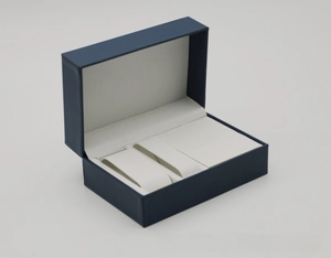 Dual-slot PU leather watch box featuring deep blue exterior and soft white interior lining
