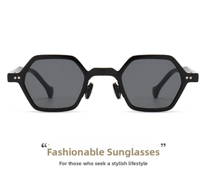 Detail of black hexagonal sunglasses featuring silver metal nose pads and rivets