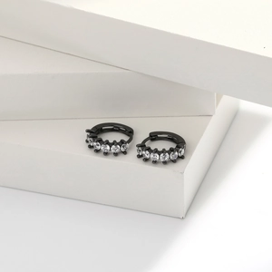 Detail of s925 silver hoop earrings with black plating and micro-pave zircon crystals