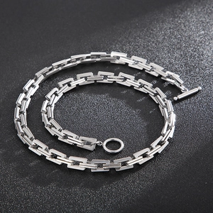 Detailed view of silver stainless steel box chain necklace with OT toggle clasp design