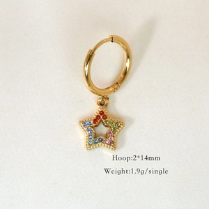 Close-up of 14K gold hoop earrings with star pendant featuring colorful zircon stones